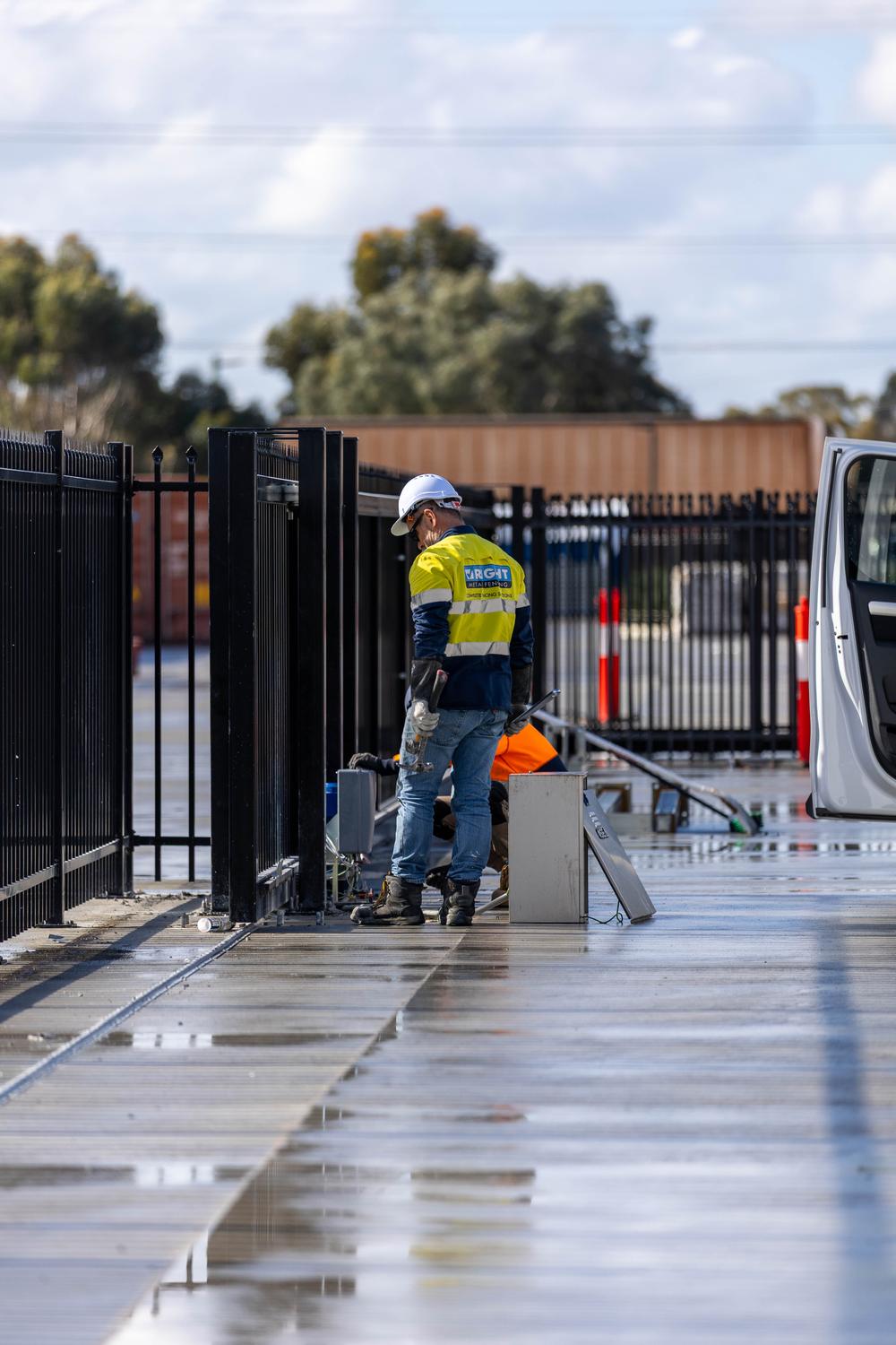 RMF technician working on an automated sliding gate